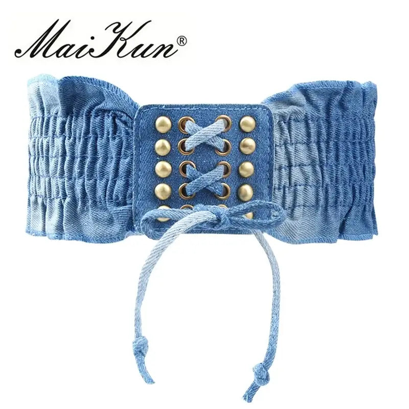 Women’s Elastic Dress Belt in light blue denim with gold accents and stylish lacing.